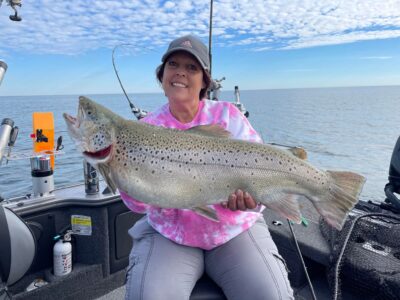 Francine Brant of Tonawanda holds up a 27-pound brown trout she caught out of Wilson with Capt. Rich Brant, her stepson. Personal best fish are caught all the time in Lake O.
